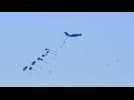 Humanitarian aid parachuted into the Gaza Strip via airdrop