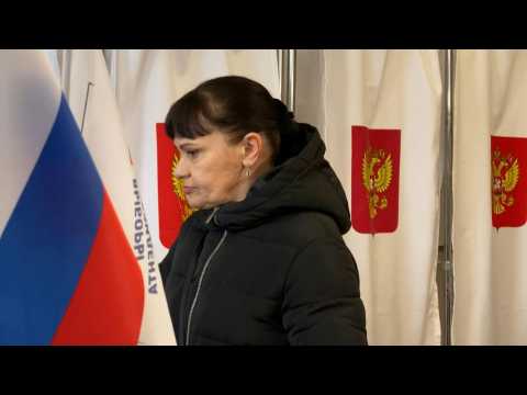 Voters cast their ballots at a polling station in Russian-controlled Crimea
