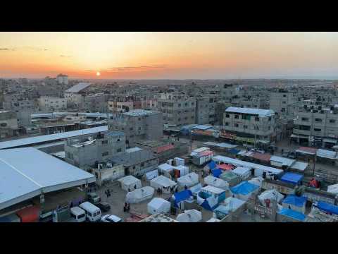 The sun sets over tents of displaced Palestinians on Ramadan eve