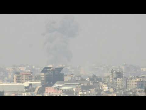 Plumes of smoke rise over northern Gaza, seen from Israel