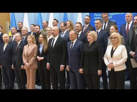 Polish and Ukrainian delegations pose for a photo ahead of talks on farm imports dispute