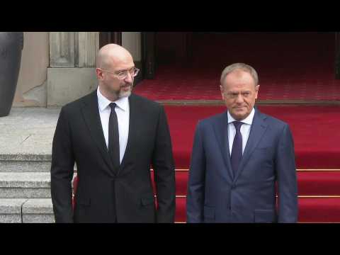 Polish Prime Minister Donald Tusk welcomes his Ukrainian counterpart Denis Shmygal in Warsaw