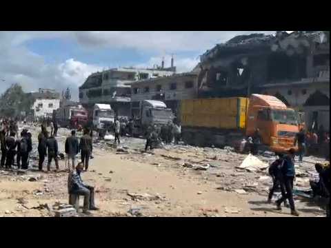 Humanitarian aid trucks arrive in Gaza City before heading north