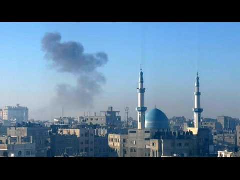 Smoke billows following an Israeli strike on the Gaza border town of Rafah