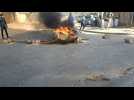 Barricades burn on the streets in Dakar as demonstration broken up