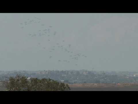 Aid being airdropped over Gaza, seen from Israel
