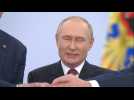Putin and separatist leaders join hands chanting 'Russia!' after Kremlin ceremony