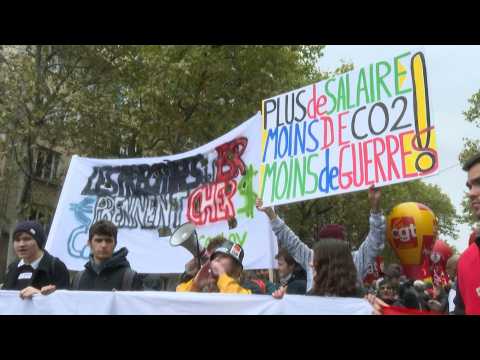 Protesters march in Paris for wages and pensions