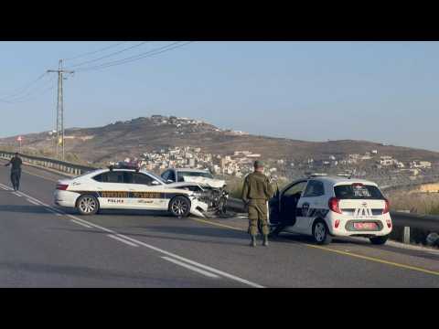 Israeli forces gather around patrol car after Nablus incident