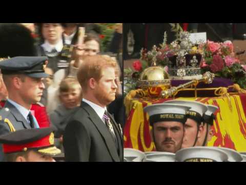 Royal Family walk down The Mall behind Queen's coffin