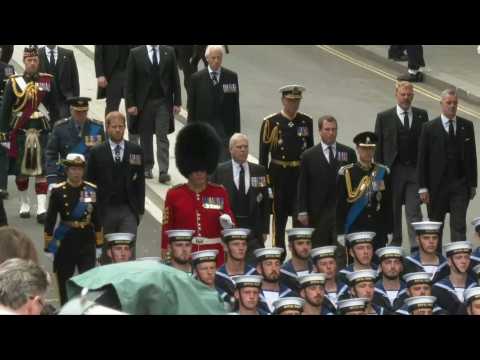 Members of the Royal Family walk behind Queen Elizabeth II's coffin