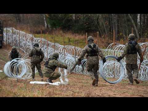 Poland builds razor wire fence along Russian border to stop possible migrant surge
