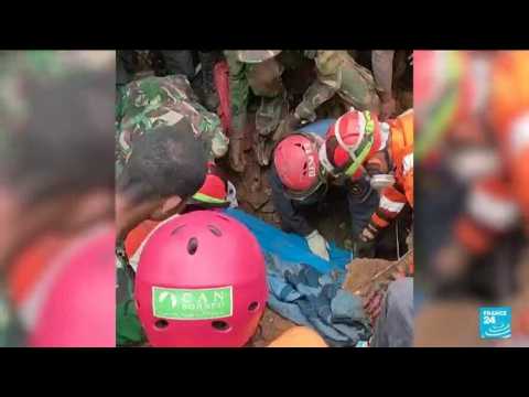 'Miracle' rescue of child trapped by Indonesia quake