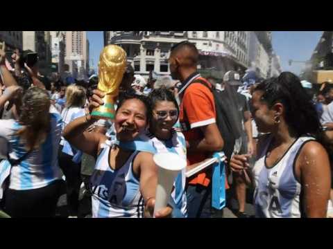 Delighted Argentine fans celebrate at Obelisk after World Cup win