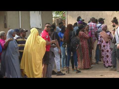 Nigerian voters gather at a polling unit before elections begin