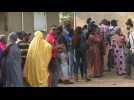 Nigerian voters gather at a polling unit before elections begin