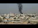 Smoke billows over West Bank city during Israeli army raid