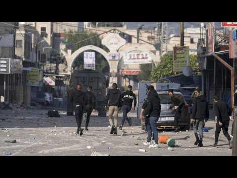 At least nine Palestinians killed in Israeli raid, dozens injured