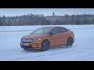 The new Skoda Enyaq Coupé RS iV in Phoenix Orange Driving in the snow
