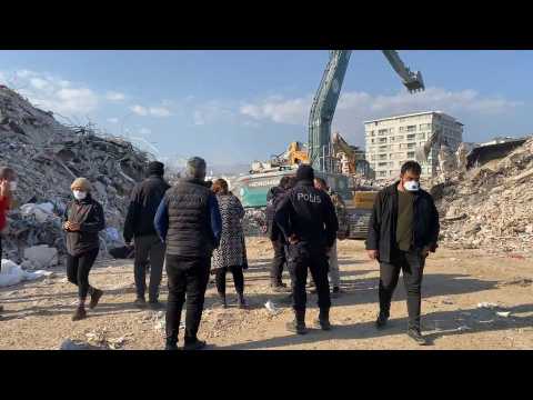 A family identifies a body retrieved from the rubble in Antakya, Turkey