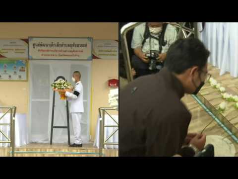 Mourners dress in black, white roses laid after Thai nursery mass shooting