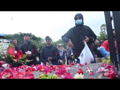 Indonesia's football fans throw petals in tribute to victims of deadly riot