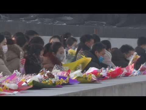 North Koreans lay flowers on New Year's Day