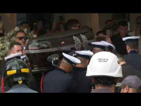 Brazilian football great Pele's coffin arrives at cemetery