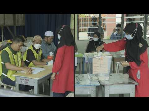 Polls open in Malaysia's tightly contested election