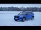 The new Skoda Kodiaq RS in Race Blue Driving in the snow