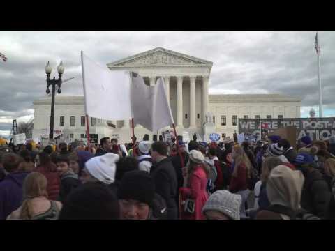 Anti-abortion protesters march in front of the US Supreme Court