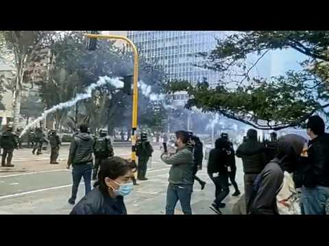 Indigenous protesters and riot police clash in Bogota