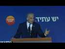 Caretaker PM Lapid arrives to deliver address after end of voting
