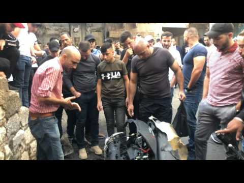 Palestinians gather at scene of explosion in Nablus
