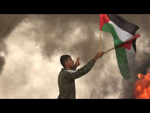 Palestinians burn tyres and hurl stones across Israel border east of Gaza City