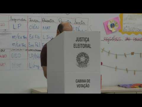 Polls open in Brazil's tight presidential runoff