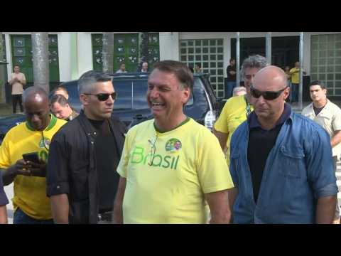 Brazil President Jair Bolsonaro leaves polling station after voting