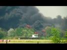 Smoke billows over burning fuel depot in Ukraine