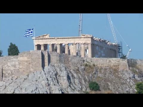 Greeks fear cost of new deal