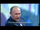 Putin says Russia overcoming economic crisis