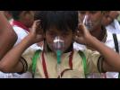 Children wear oxygen masks to highlight air pollution in Delhi