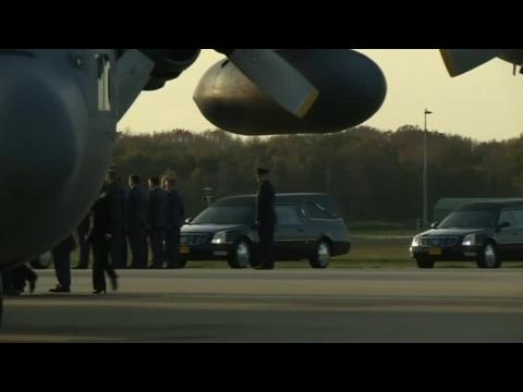 Remains of five MH17 crash victims are flown to Netherlands