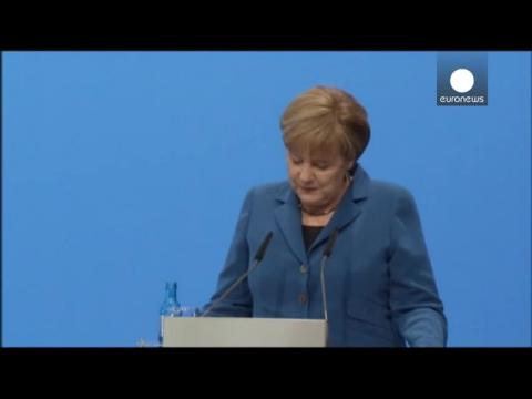 Merkel celebrates coalition deal with Social Democrats