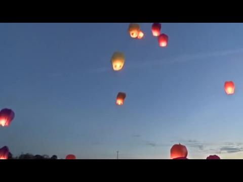 Grieving families send lanterns into Christmas night sky for loved ones