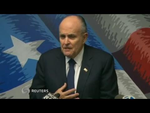 New York's Giuliani wants support for slain officer's families