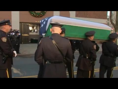 Mourners gather for slain New York policeman