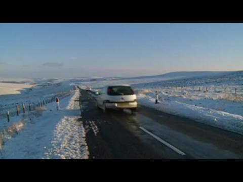 Northern England hit with heavy snow, closing roads and airport