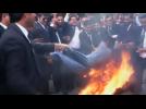 Pakistani lawyers burn effigies wrapped in French flag
