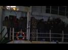 Abandoned migrant ship arrives at Italian port