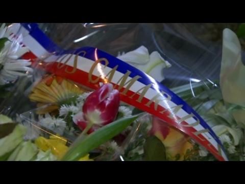 Parisians lay flowers at scene of deadly attack on Charlie Hebdo headquarters